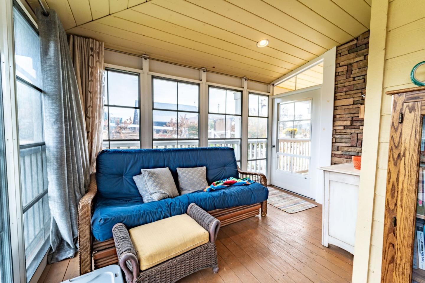 9110 Burchell Road Gilroy, CA 95020 - Photo 43 of 52 a living room with furniture and a floor to ceiling window