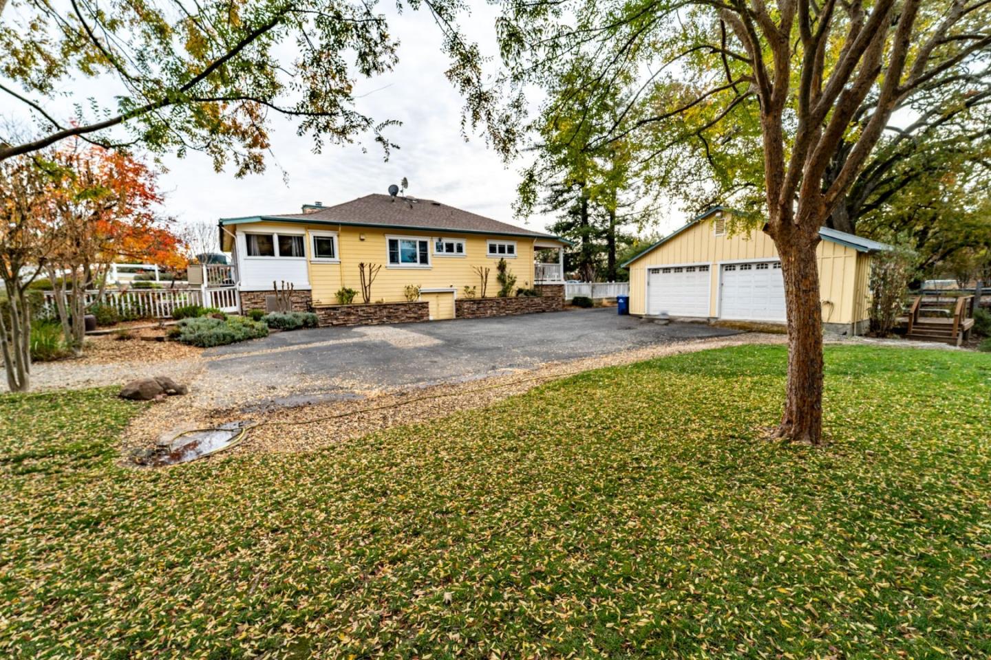 9110 Burchell Road Gilroy, CA 95020 - Photo 49 of 52 a front view of a house with a yard and tree