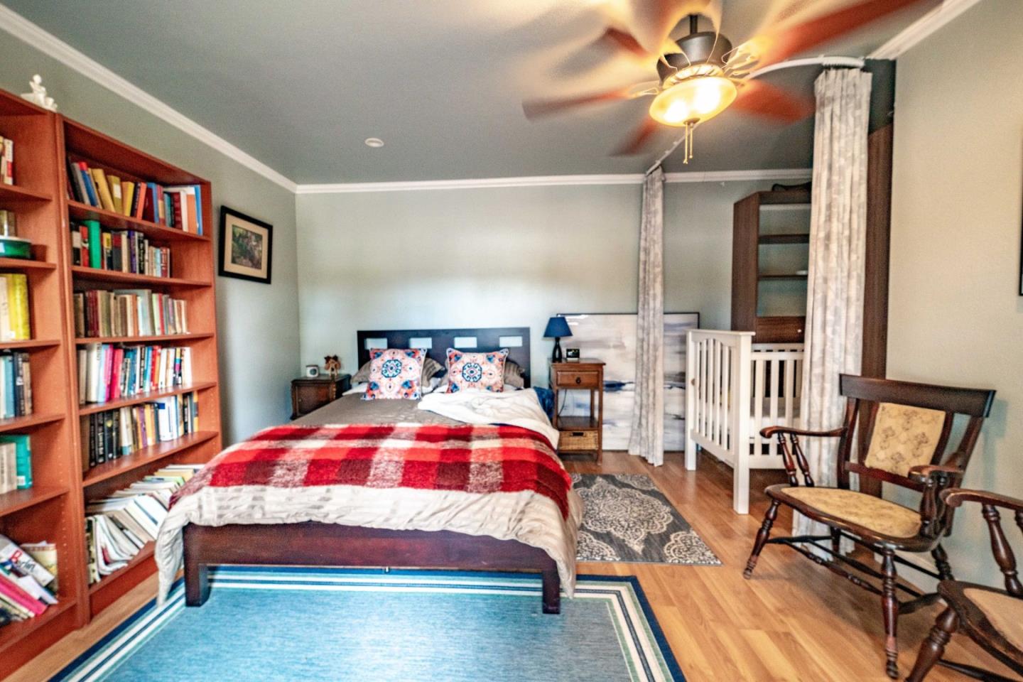 9110 Burchell Road Gilroy, CA 95020 - Photo 51 of 52 a bedroom with a bed furniture and a book shelf