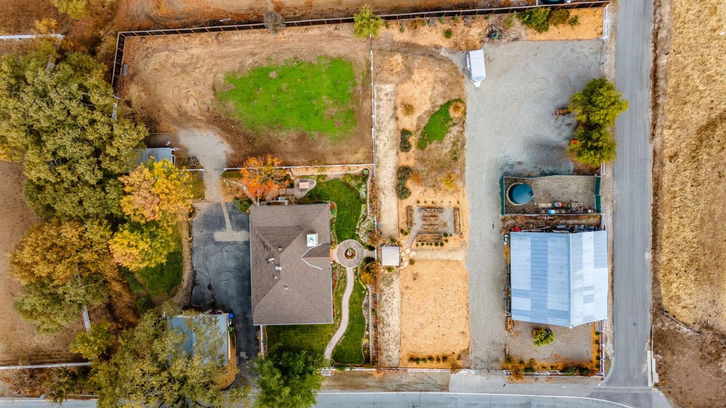 9110 Burchell Road Gilroy, CA 95020 - Photo 9 of 52 an aerial view of a house with a yard and large tree