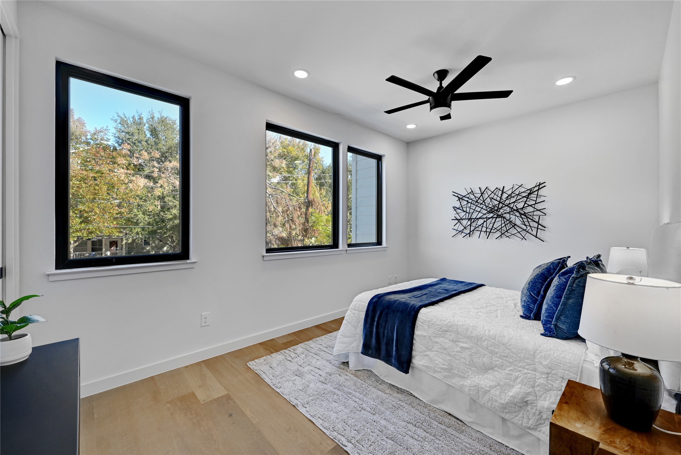 2717 Lyons Road, Unit 1 Austin, TX 78702 - Photo 17 of 34 Bedroom featuring light wood-style floors, recessed lighting, and ceiling fan