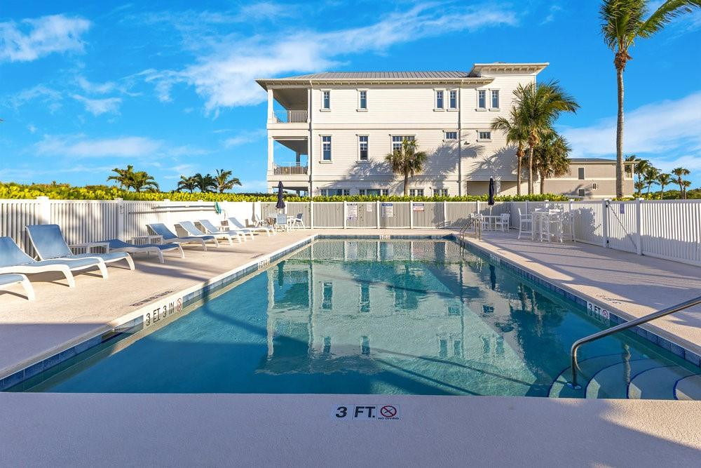 5104 Watersong Way Fort Pierce, FL 34949 - Photo 13 of 15 a view of swimming pool with outdoor seating