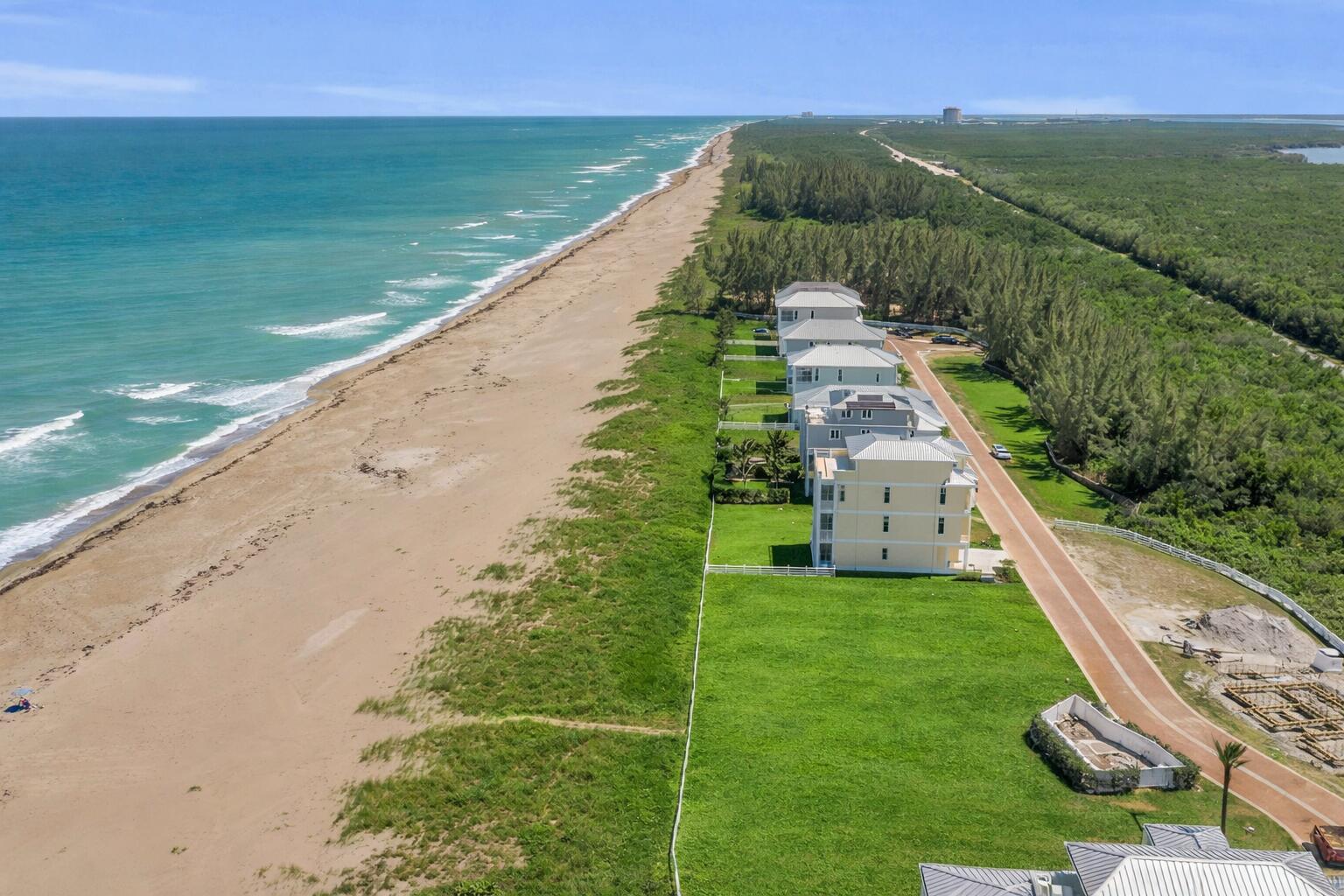 5104 Watersong Way Fort Pierce, FL 34949 - Photo 5 of 15 a view of a lake with a yard