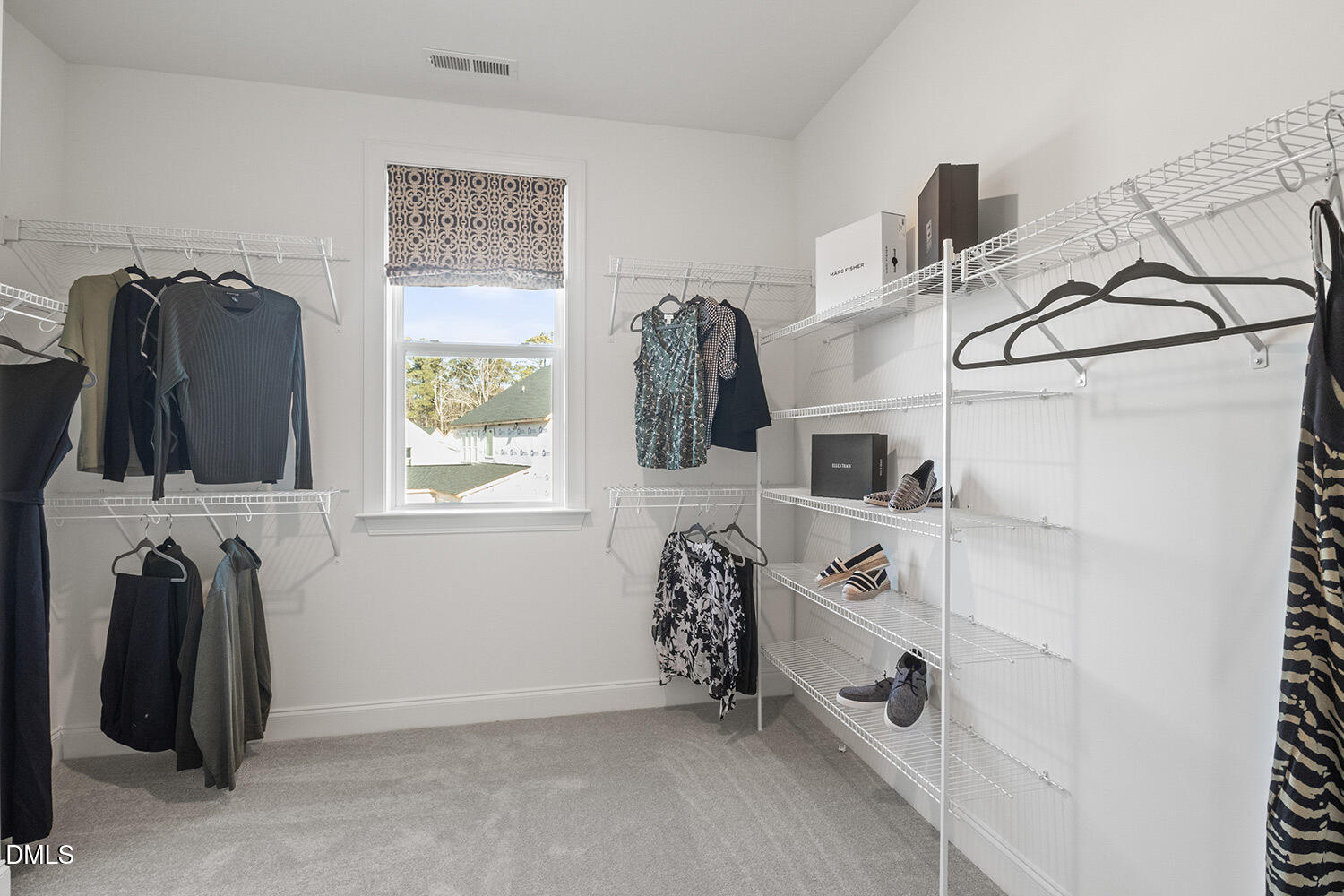8120 Andrea Lane Raleigh, NC 27613 - Photo 13 of 25 a view of walk in closet with clothes and shoes