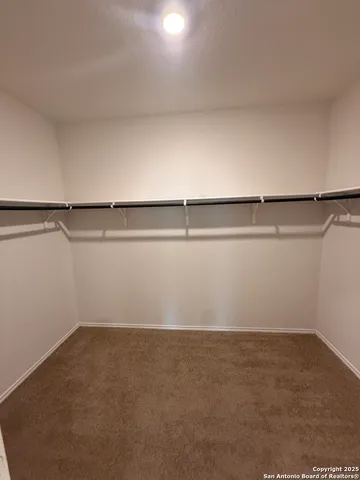 a view of a house with a tree in the background