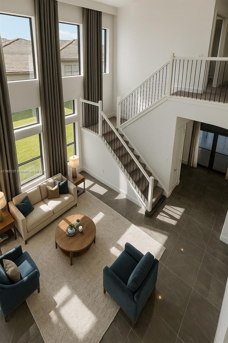 8215 Crystal Downs Avenue, Unit 8215 Boca Raton, FL 33434 - Photo 11 of 95 a living room with furniture and a flat screen tv with wooden floor