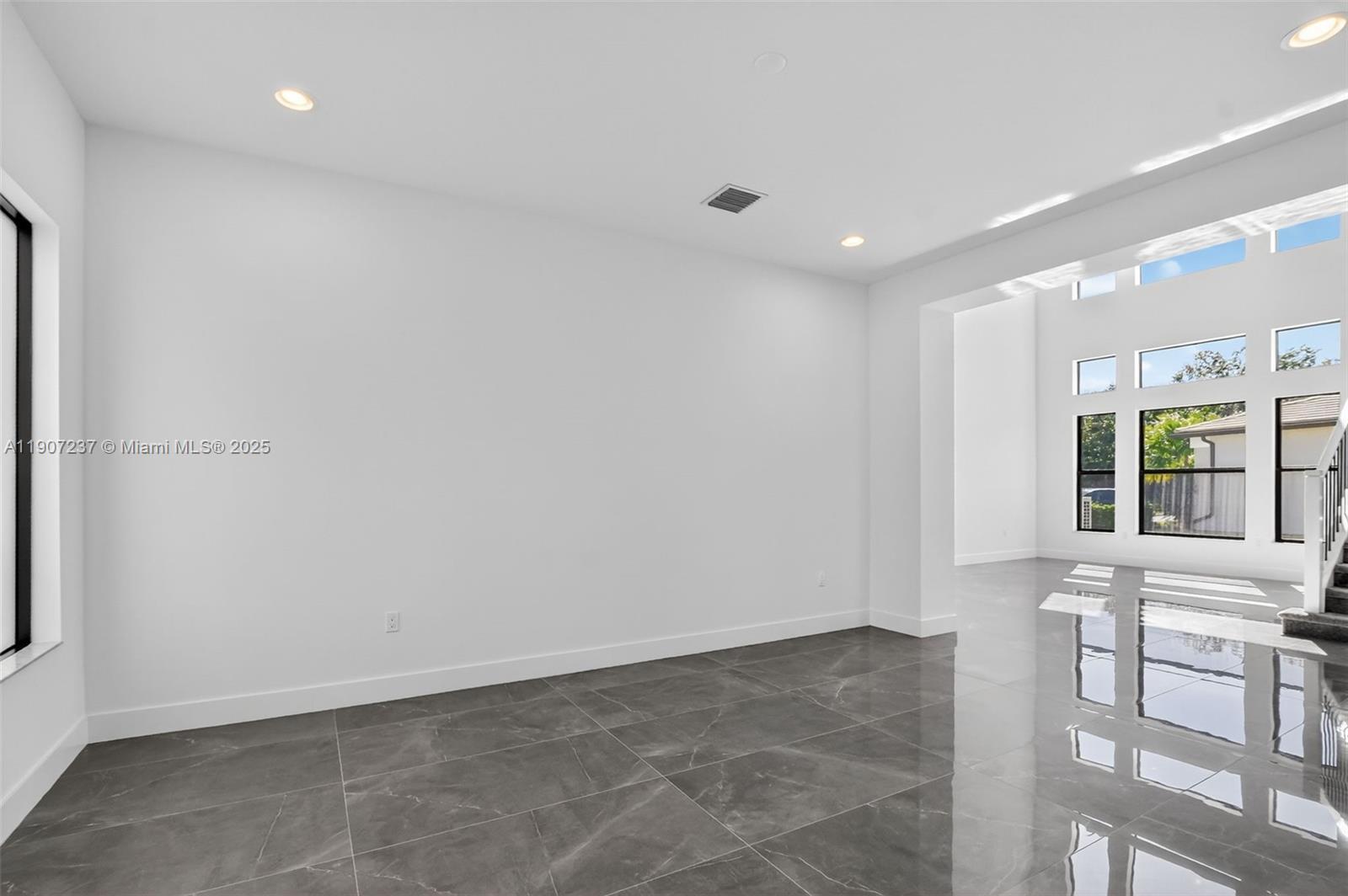 8215 Crystal Downs Avenue, Unit 8215 Boca Raton, FL 33434 - Photo 16 of 95 a view of an empty room with a window