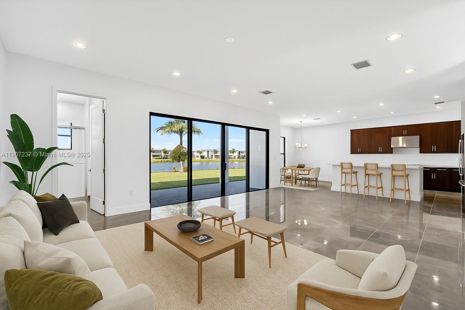 8215 Crystal Downs Avenue, Unit 8215 Boca Raton, FL 33434 - Photo 20 of 95 a living room with furniture and a large window