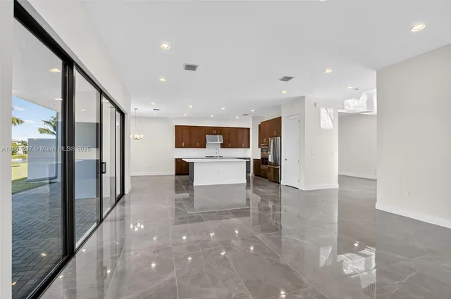 a bedroom with a large bed and a potted plant
