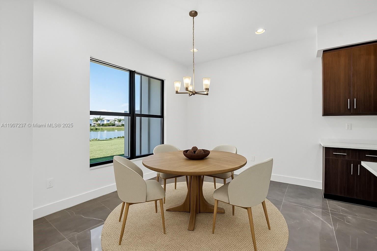 8215 Crystal Downs Avenue, Unit 8215 Boca Raton, FL 33434 - Photo 23 of 95 a dining room with furniture and window