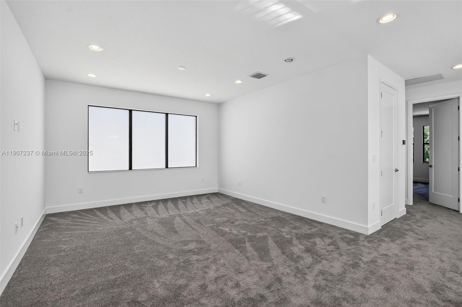 8215 Crystal Downs Avenue, Unit 8215 Boca Raton, FL 33434 - Photo 35 of 95 an empty room with windows and closet