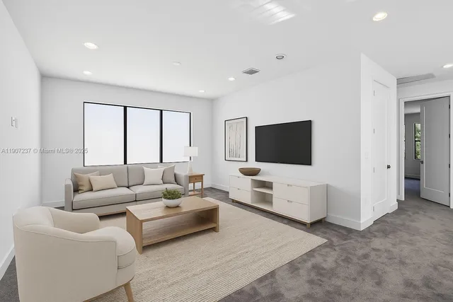 a view of a house with a yard and potted plants