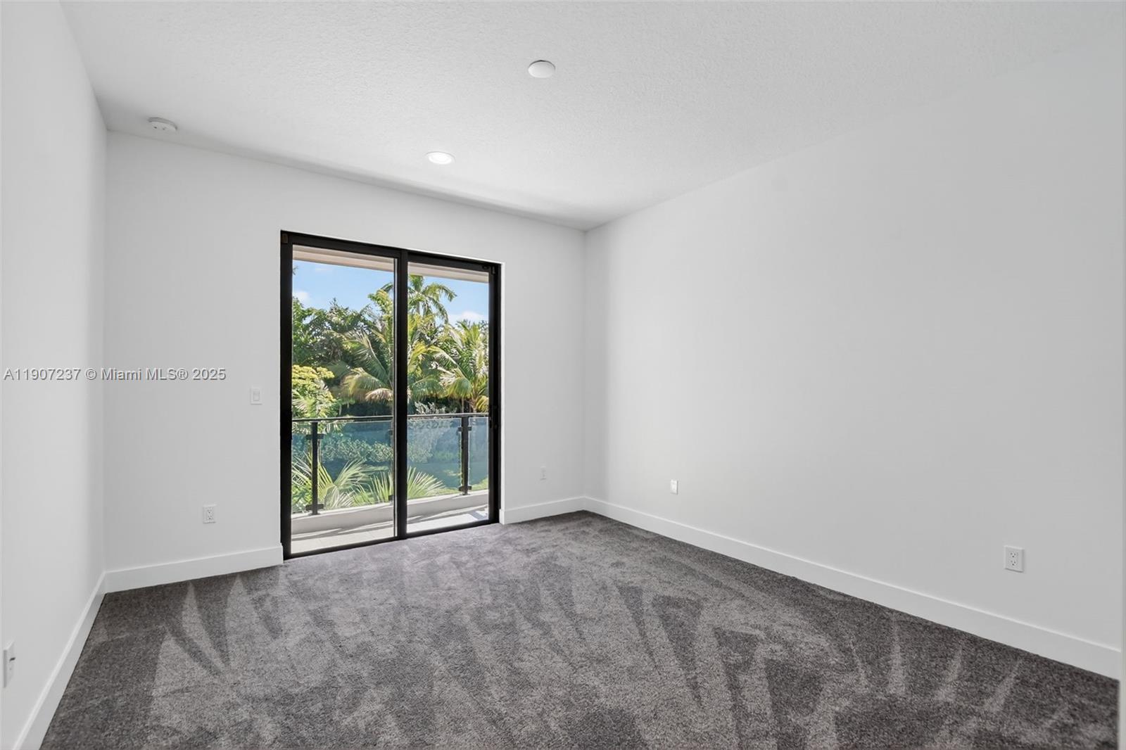 8215 Crystal Downs Avenue, Unit 8215 Boca Raton, FL 33434 - Photo 37 of 95 a view of an empty room with wooden floor and a window