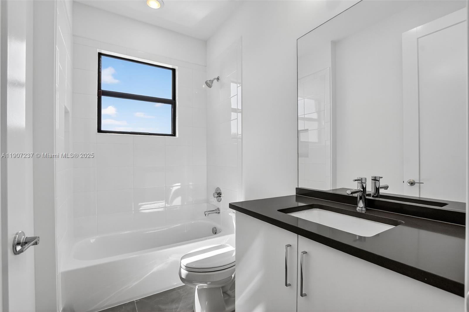 8215 Crystal Downs Avenue, Unit 8215 Boca Raton, FL 33434 - Photo 40 of 95 a bathroom with a sink a toilet and shower