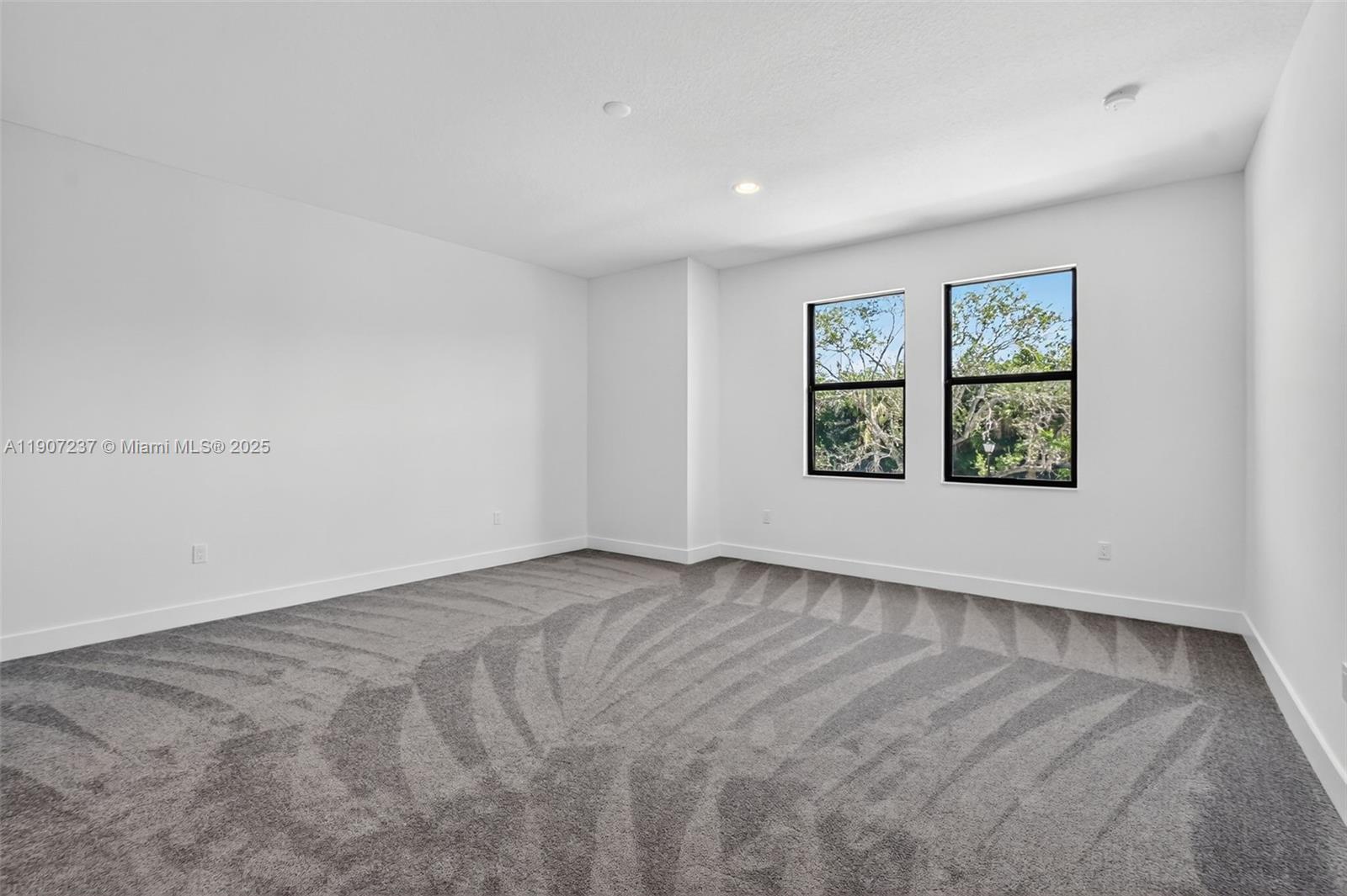 8215 Crystal Downs Avenue, Unit 8215 Boca Raton, FL 33434 - Photo 43 of 95 an empty room with windows