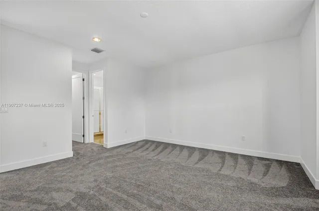 an aerial view of multiple houses with yard