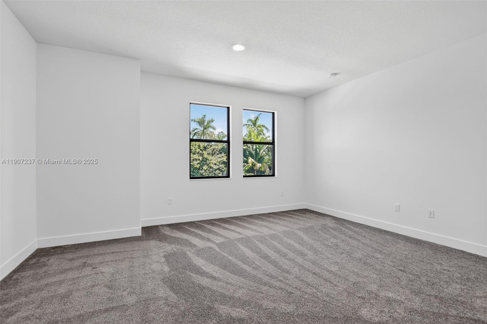 8215 Crystal Downs Avenue, Unit 8215 Boca Raton, FL 33434 - Photo 45 of 95 an empty room with windows