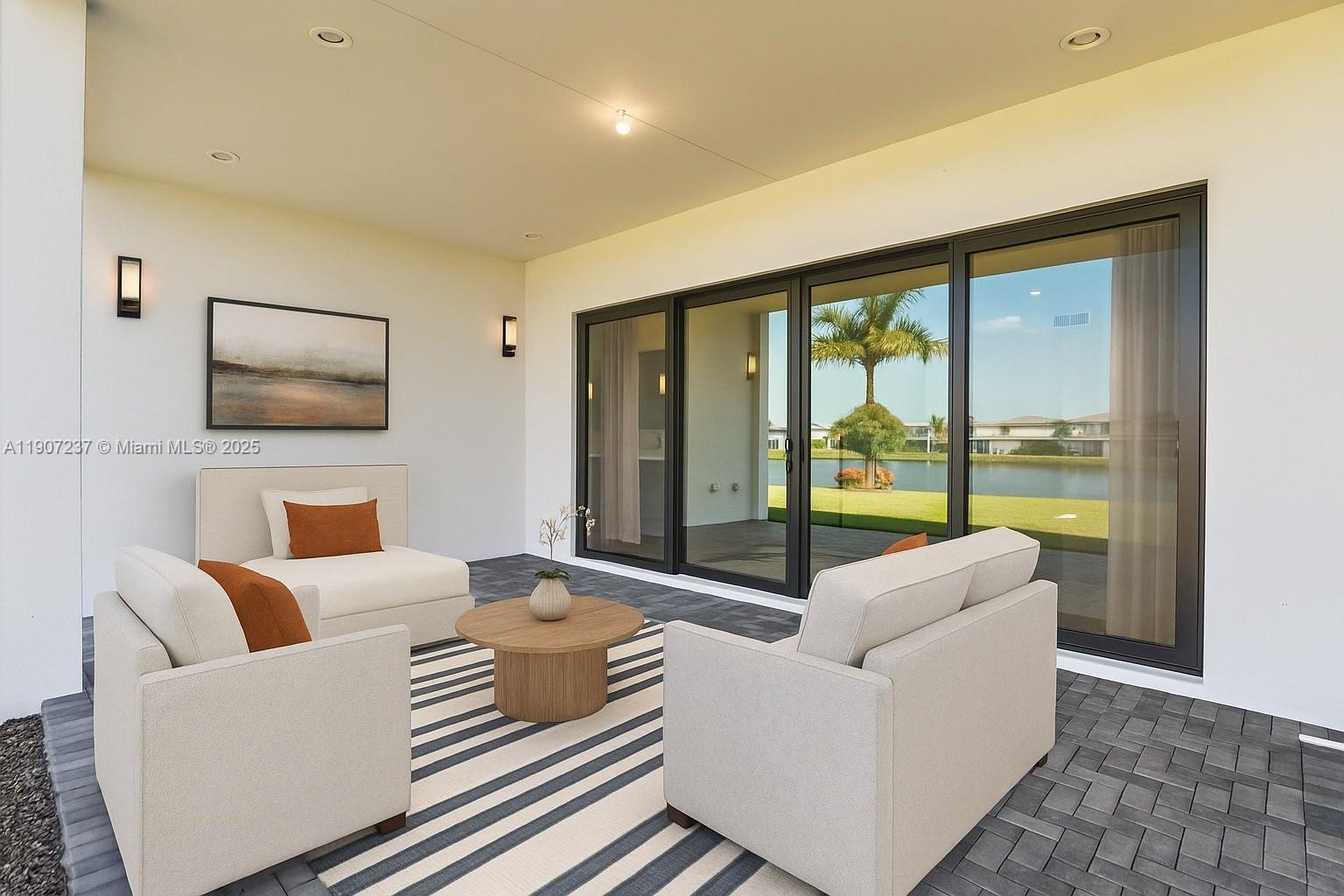 8215 Crystal Downs Avenue, Unit 8215 Boca Raton, FL 33434 - Photo 62 of 95 a living room with furniture and large windows