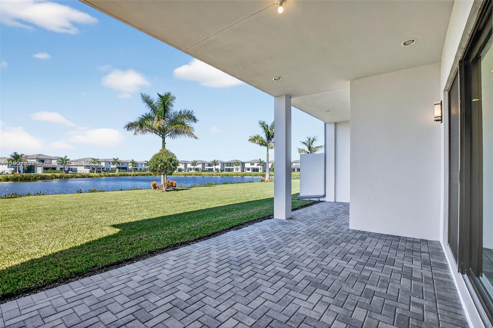8215 Crystal Downs Avenue, Unit 8215 Boca Raton, FL 33434 - Photo 64 of 95 a view of a house with a yard and potted plants