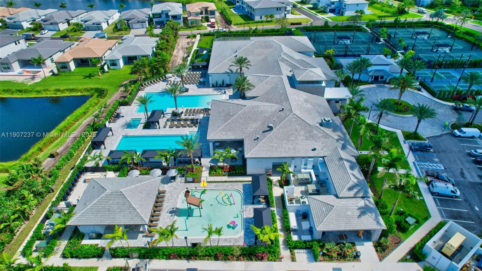 8215 Crystal Downs Avenue, Unit 8215 Boca Raton, FL 33434 - Photo 79 of 95 an aerial view of multiple houses with yard