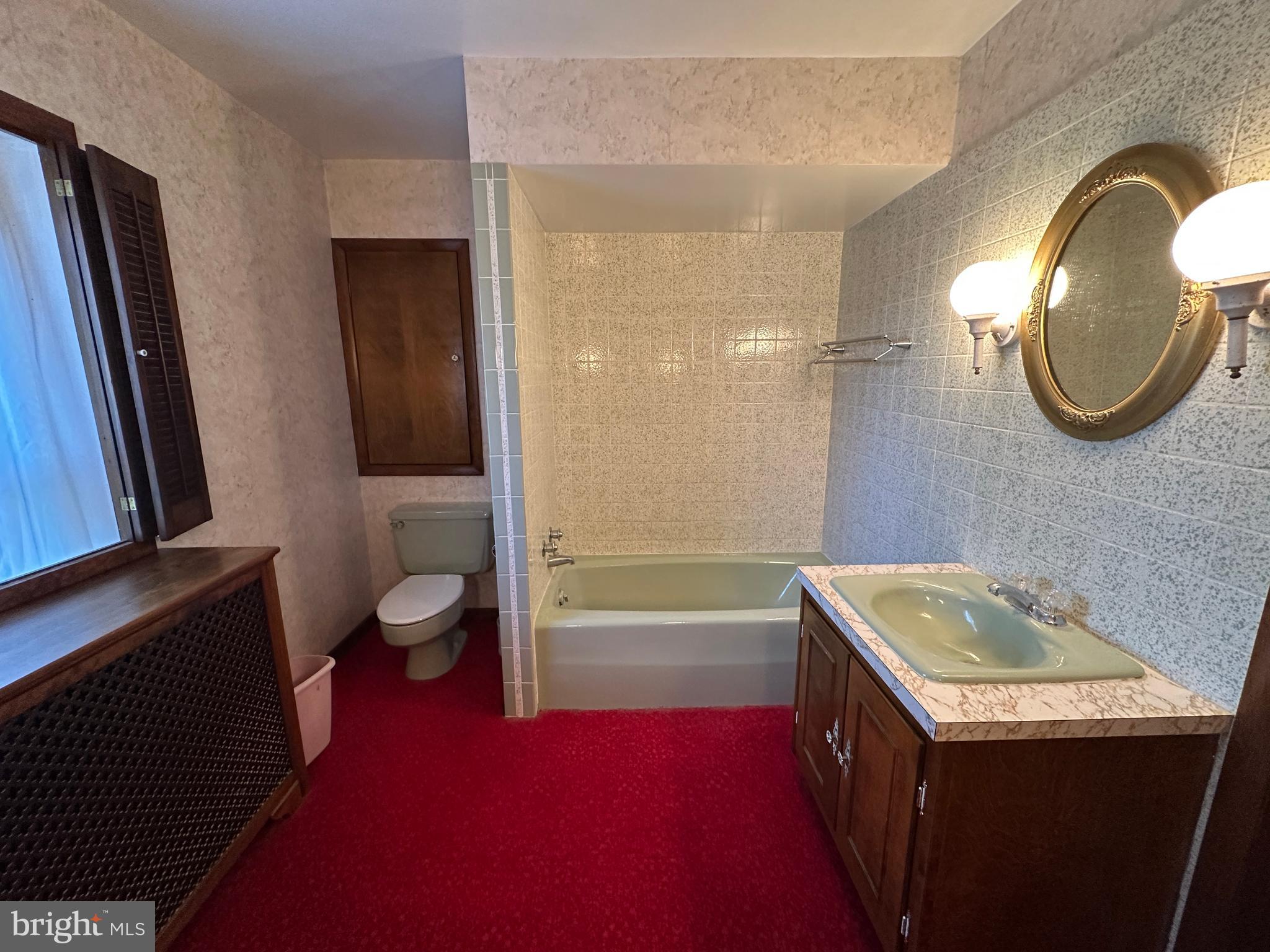 12429 Angle Drive Clear Spring, MD 21722 - Photo 101 of 129 a bathroom with a sink a toilet and tub