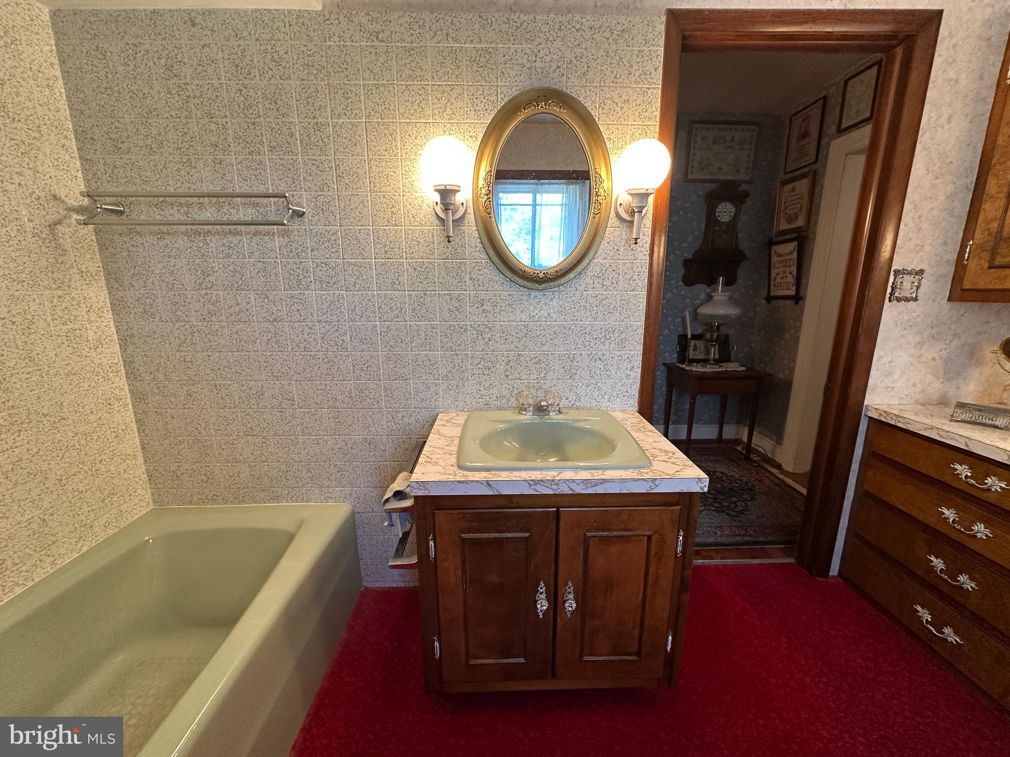 12429 Angle Drive Clear Spring, MD 21722 - Photo 104 of 129 a bathroom with a sink a bathtub and a shower