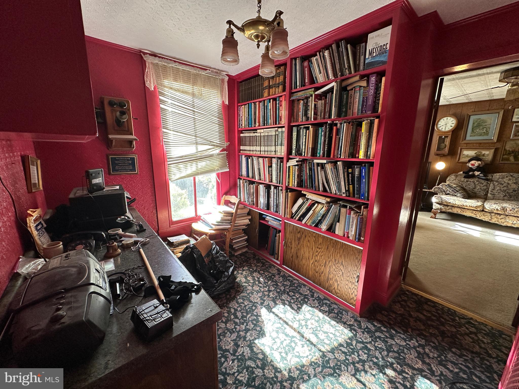 12429 Angle Drive Clear Spring, MD 21722 - Photo 53 of 129 a view of a workspace with furniture and a book shelf