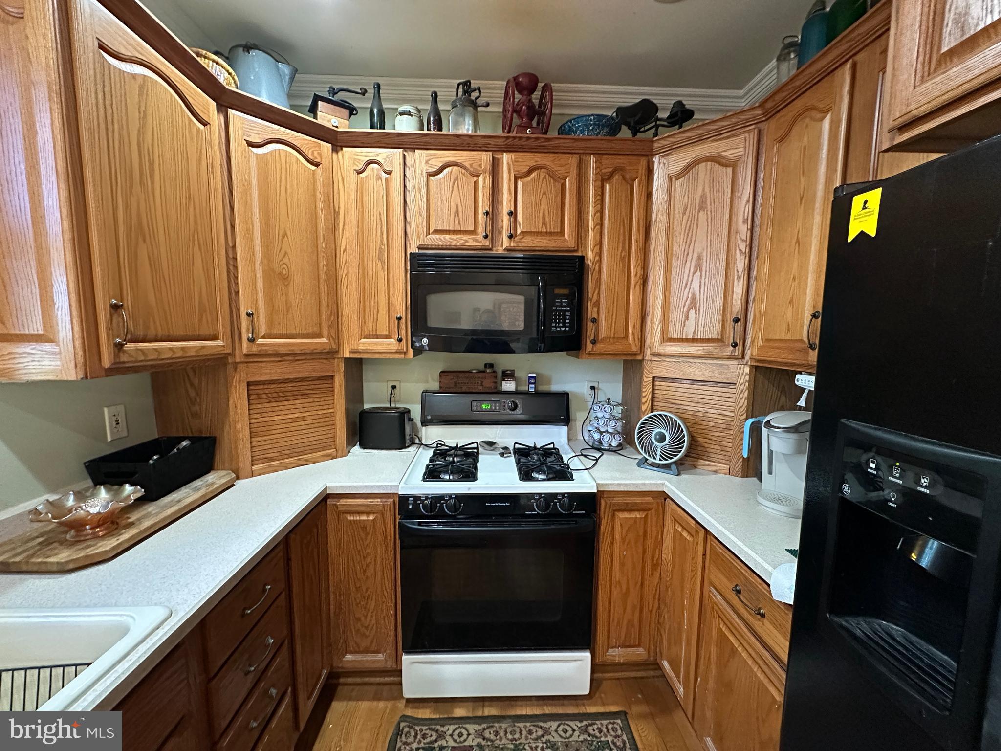 12429 Angle Drive Clear Spring, MD 21722 - Photo 61 of 129 a kitchen with granite countertop a refrigerator stove and microwave