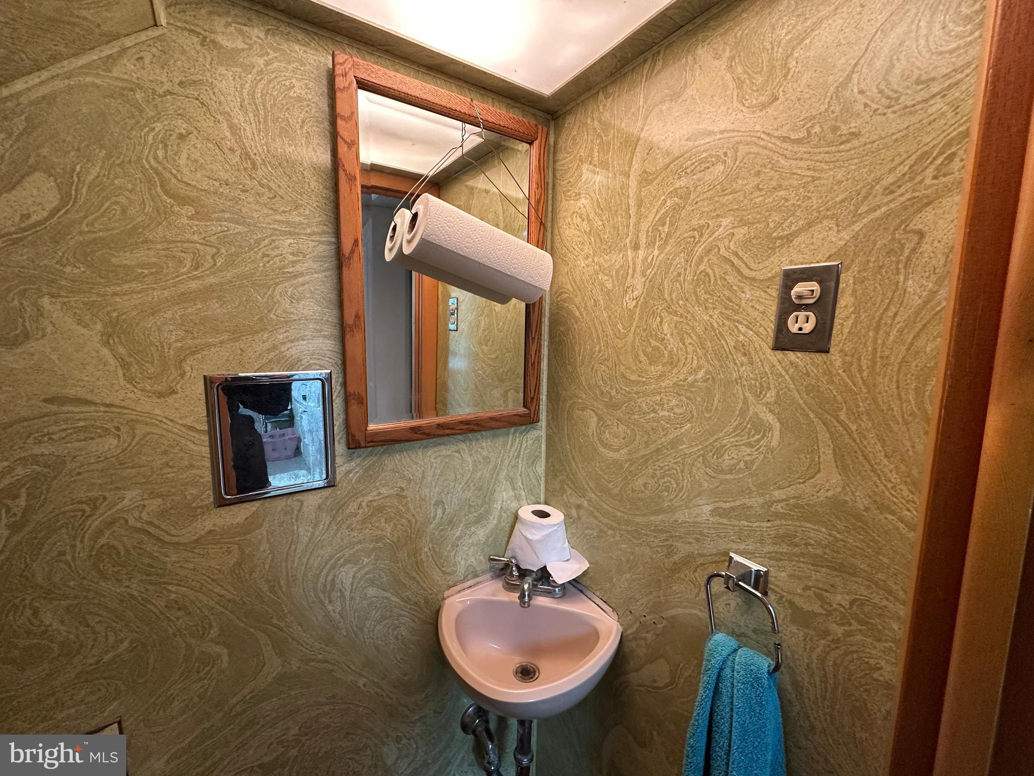 12429 Angle Drive Clear Spring, MD 21722 - Photo 81 of 129 a bathroom with a sink and a mirror
