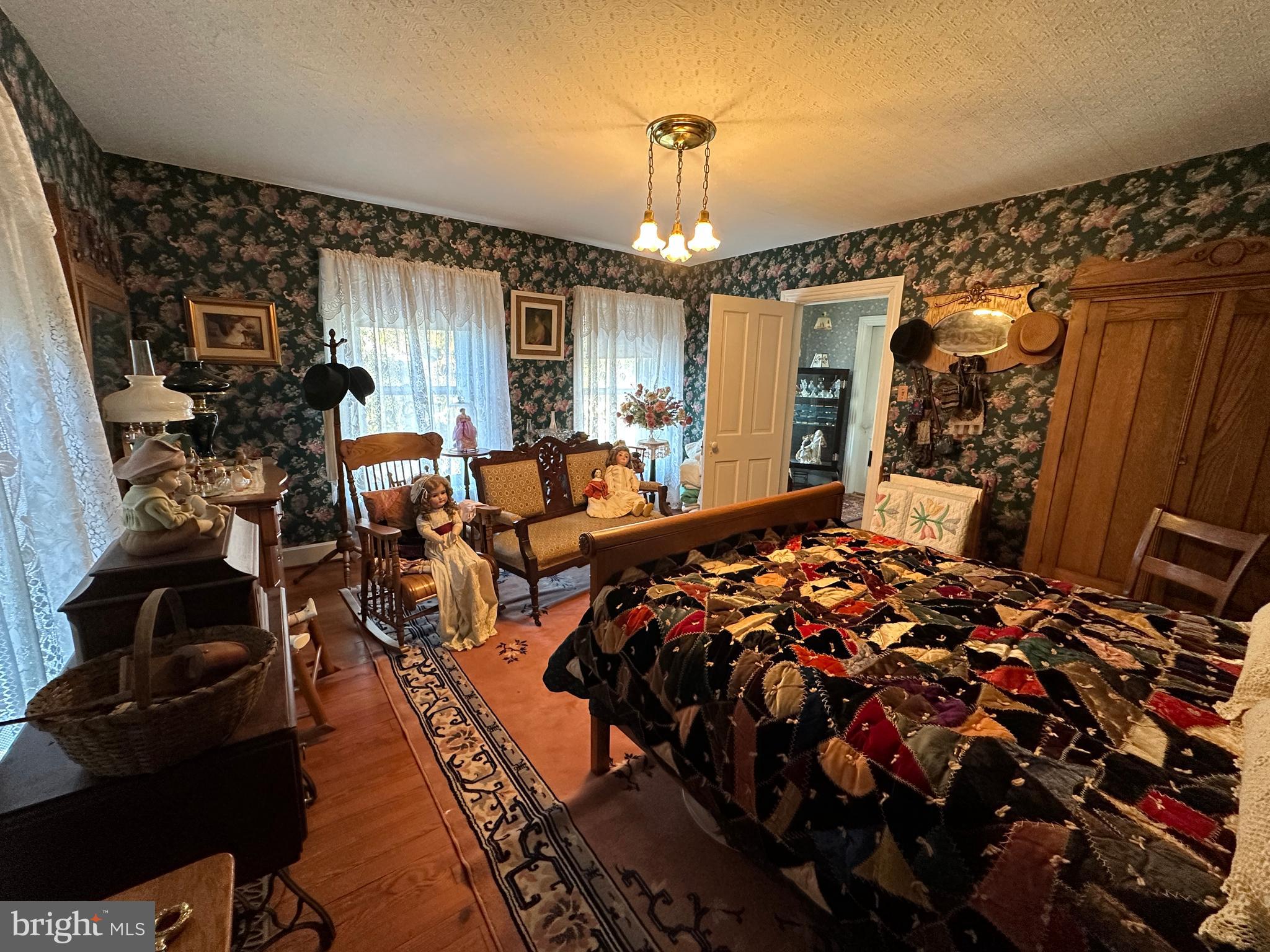 12429 Angle Drive Clear Spring, MD 21722 - Photo 95 of 129 a bed room with a bed and a chandelier