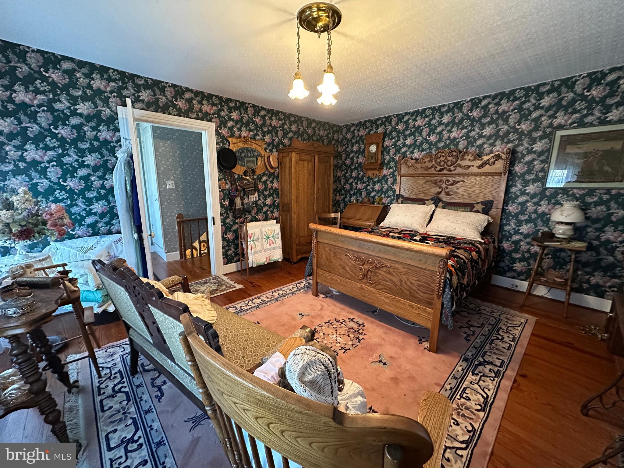 12429 Angle Drive Clear Spring, MD 21722 - Photo 96 of 129 a living room with furniture a rug and a chandelier