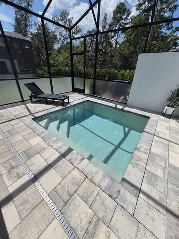 a view of a swimming pool with a yard