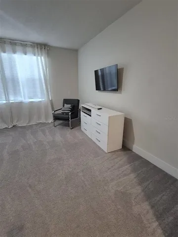 a view of livingroom with furniture and flat screen tv