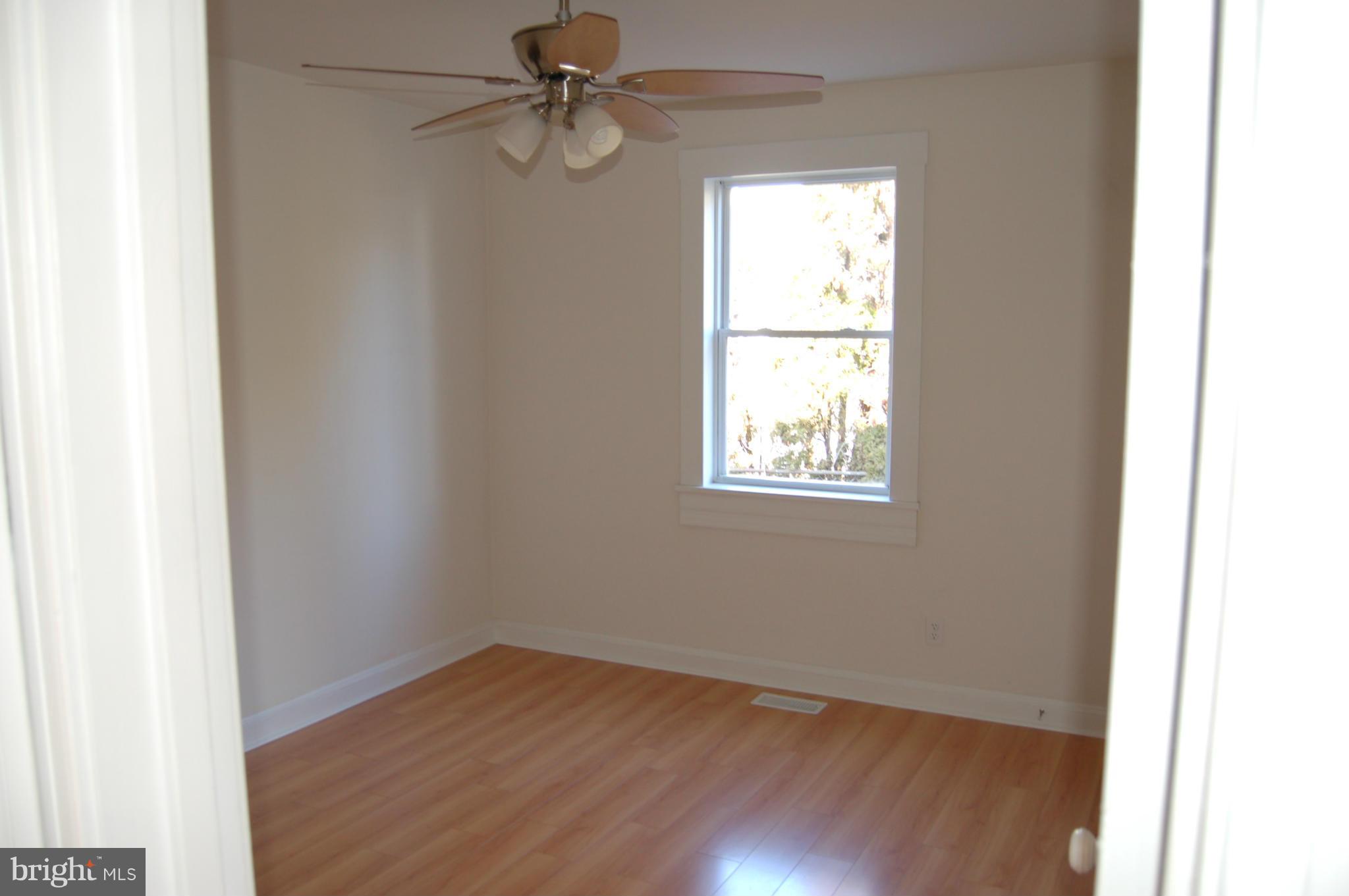 2 Plateau Road Baltimore, MD 21221 - Photo 22 of 28 an empty room with wooden floor closet and windows