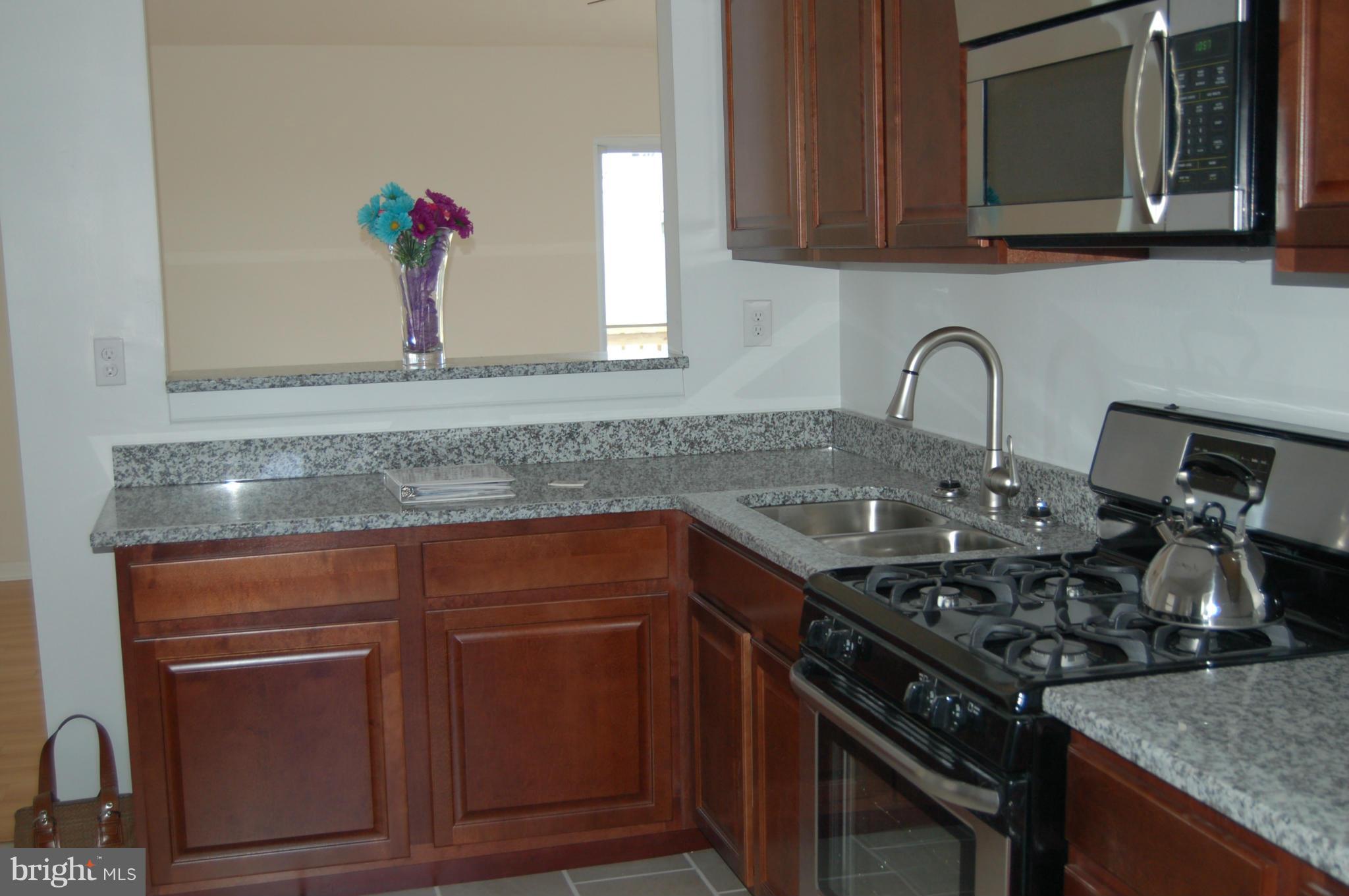 2 Plateau Road Baltimore, MD 21221 - Photo 10 of 28 a kitchen with a stove and a sink