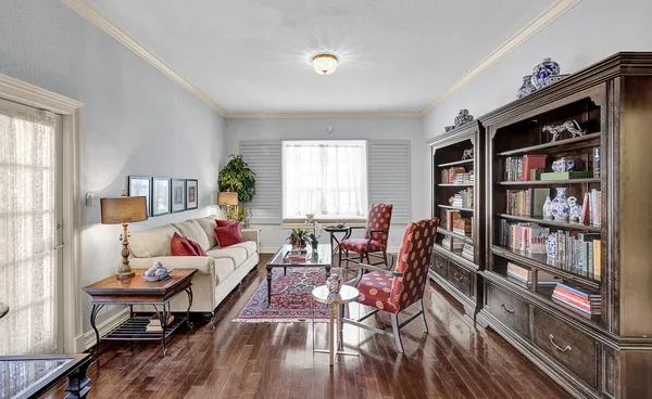a living room with furniture and a window