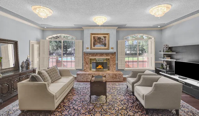 a view of a a dining room with furniture window and wooden floor
