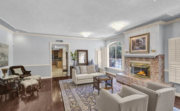 a kitchen with stainless steel appliances granite countertop a sink a stove and a wooden floors