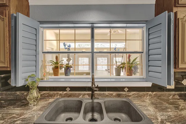 a view of a bathroom with a sink and mirror