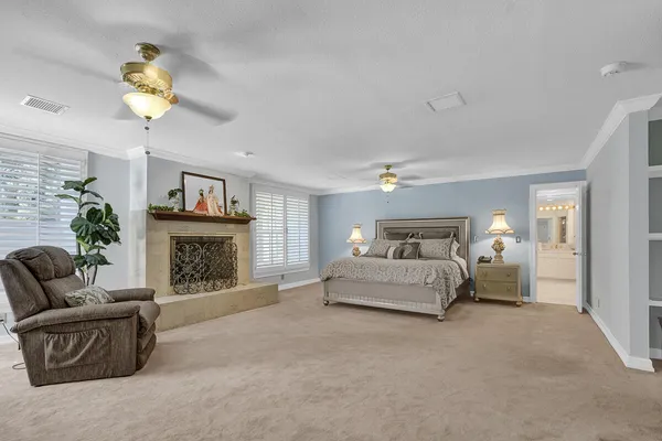 a view of a livingroom with furniture and a ceiling fan