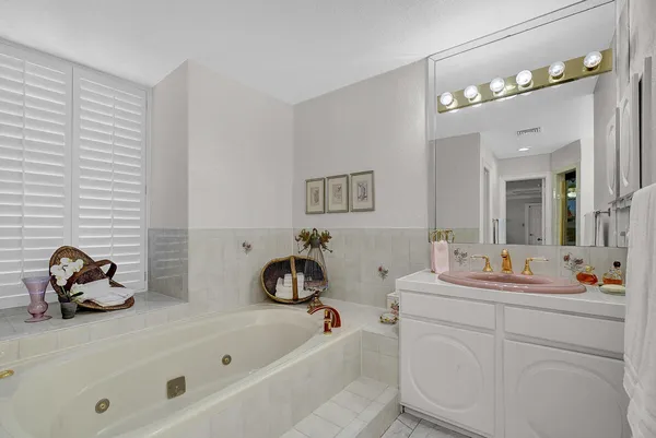 a view of a house with a swimming pool and porch