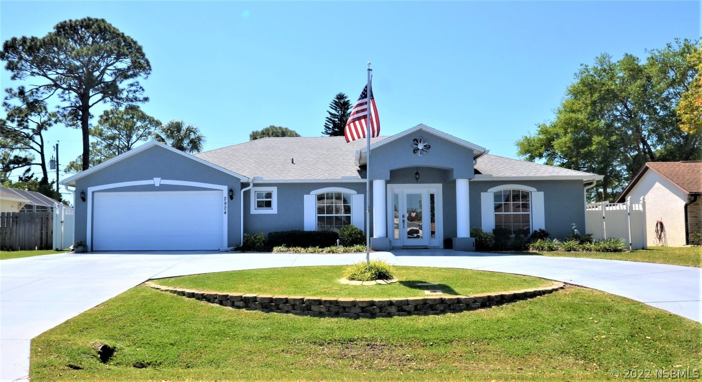 2924 Royal Palm Drive Edgewater, FL 32141 - Photo 1 of 43 a front view of a house with a yard and porch