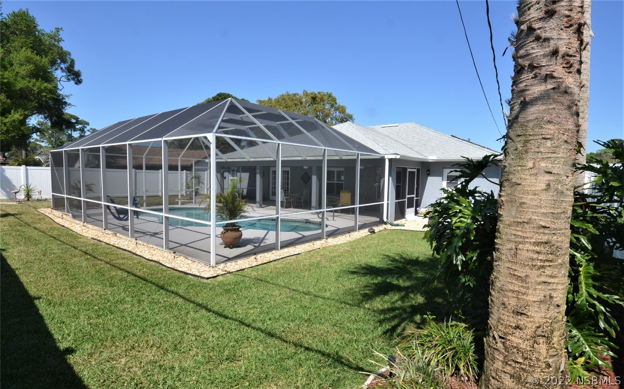 2924 Royal Palm Drive Edgewater, FL 32141 - Photo 14 of 43 a view of a house with backyard sitting area and garden