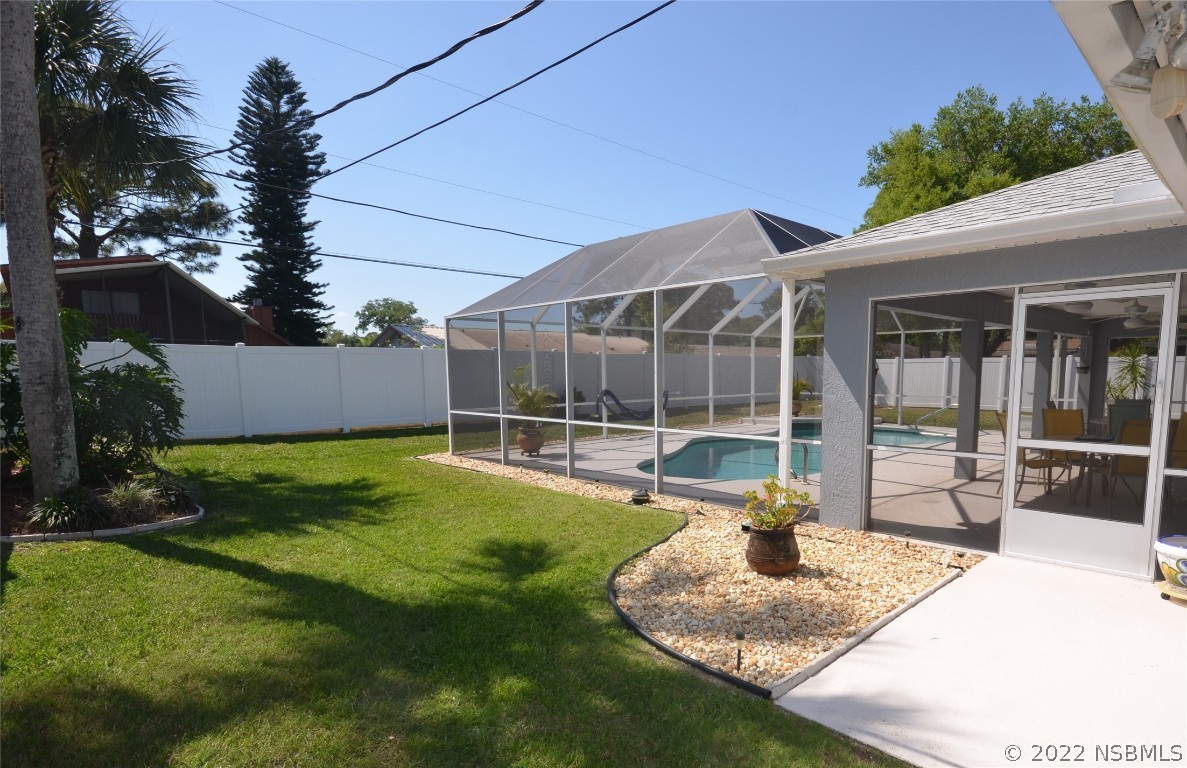 2924 Royal Palm Drive Edgewater, FL 32141 - Photo 15 of 43 a swimming pool with outdoor seating and yard