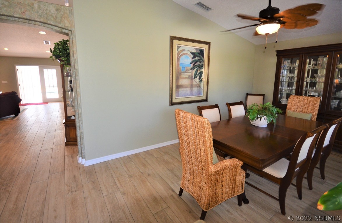 2924 Royal Palm Drive Edgewater, FL 32141 - Photo 18 of 43 a view of a dining room with furniture and wooden floor