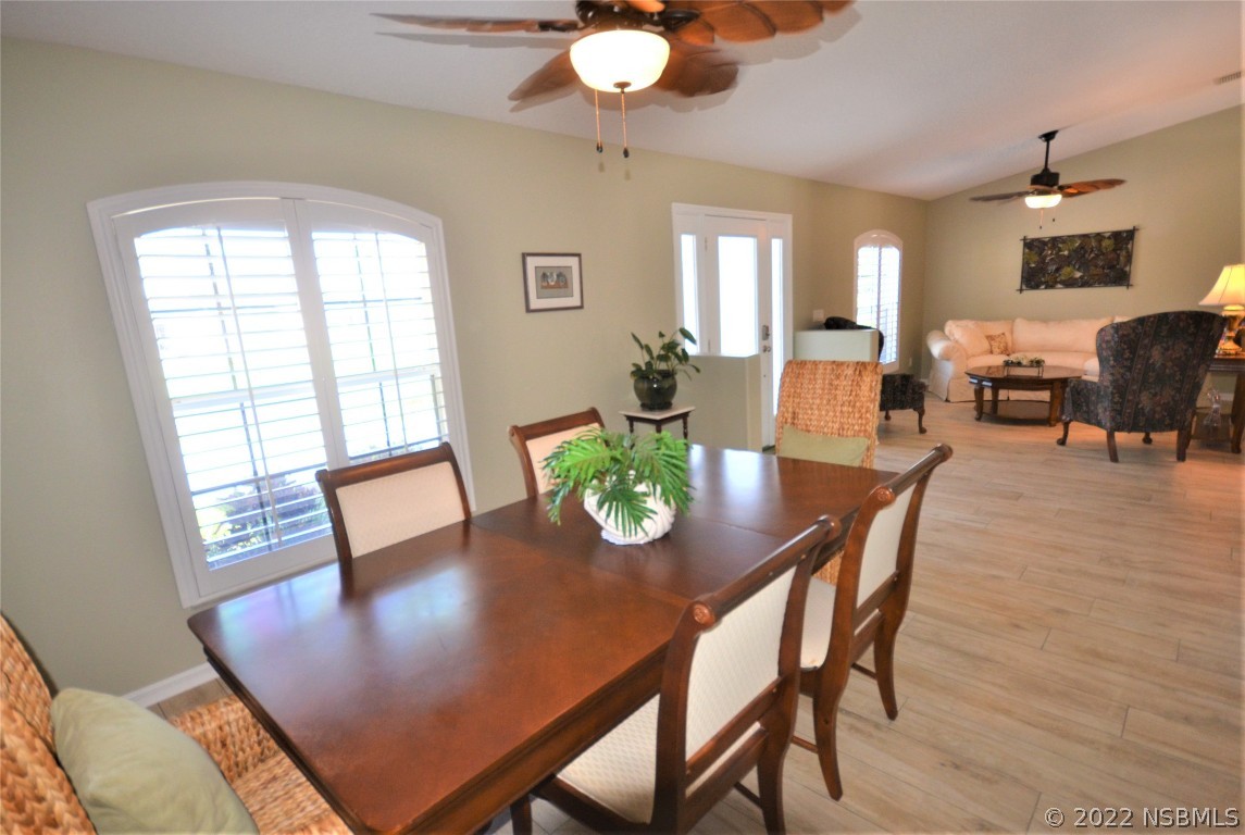 2924 Royal Palm Drive Edgewater, FL 32141 - Photo 19 of 43 a view of a dining room with furniture and wooden floor