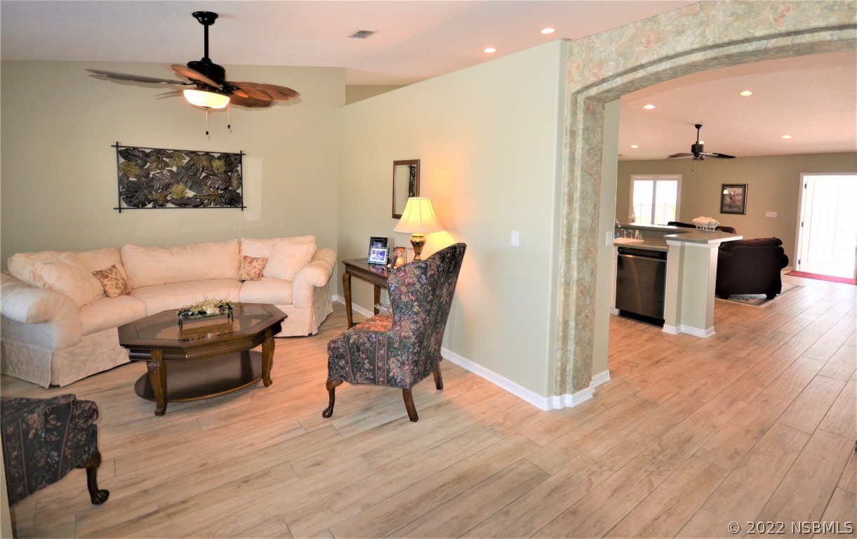 2924 Royal Palm Drive Edgewater, FL 32141 - Photo 25 of 43 a living room with furniture and a wooden floor