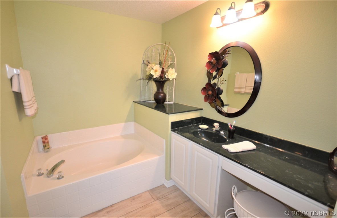 2924 Royal Palm Drive Edgewater, FL 32141 - Photo 34 of 43 a bathroom with a sink and a mirror