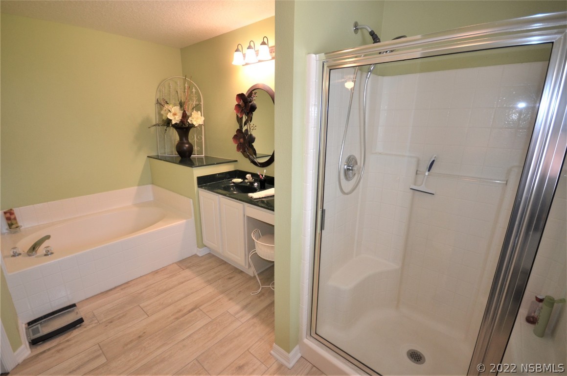 2924 Royal Palm Drive Edgewater, FL 32141 - Photo 36 of 43 a bathroom with a tub a sink and a shower