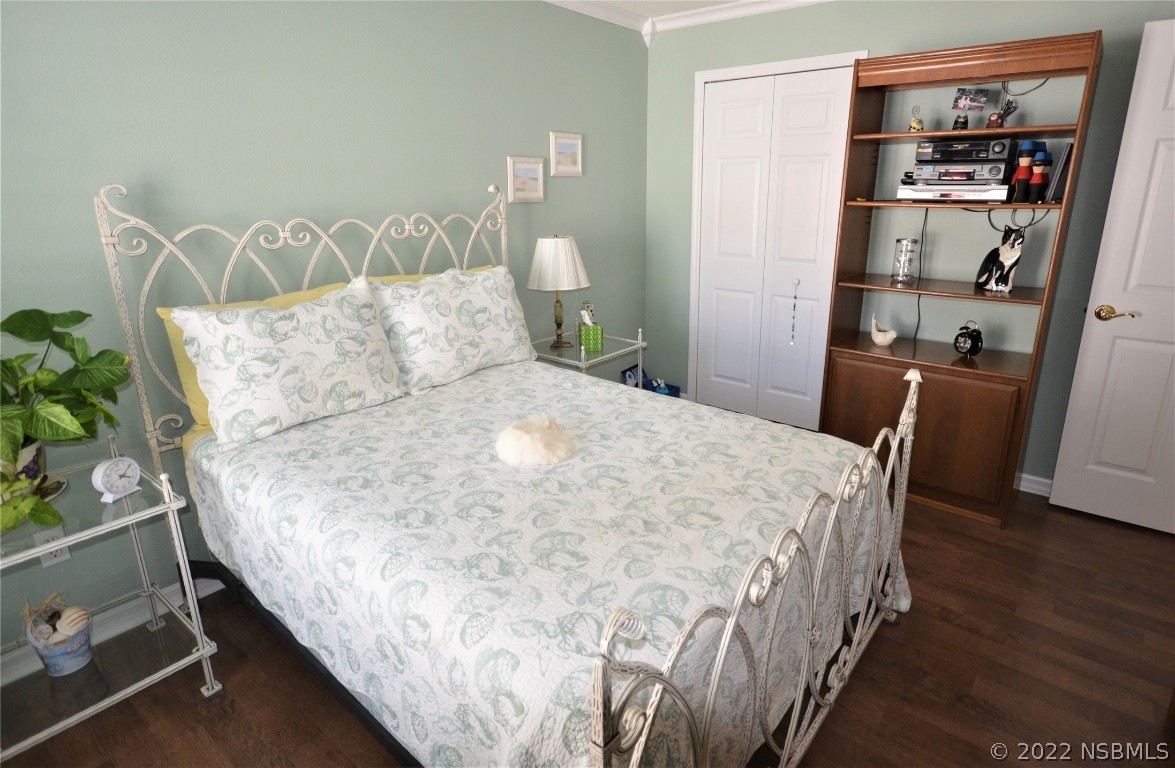 2924 Royal Palm Drive Edgewater, FL 32141 - Photo 37 of 43 a large bed sitting in a bedroom next to a book shelf